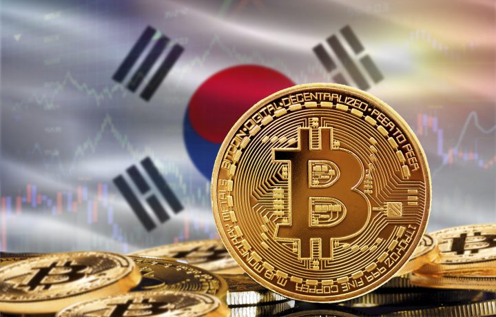 Das Bild zeigt eine Bitcoin-Münze und die südkoreanische Flagge