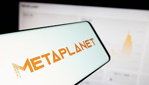 Das Bild zeigt das Metaplanet-Logo auf einem Smartphone